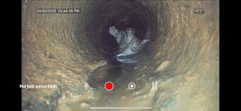 Drain camera revealing partial blockage in pipe