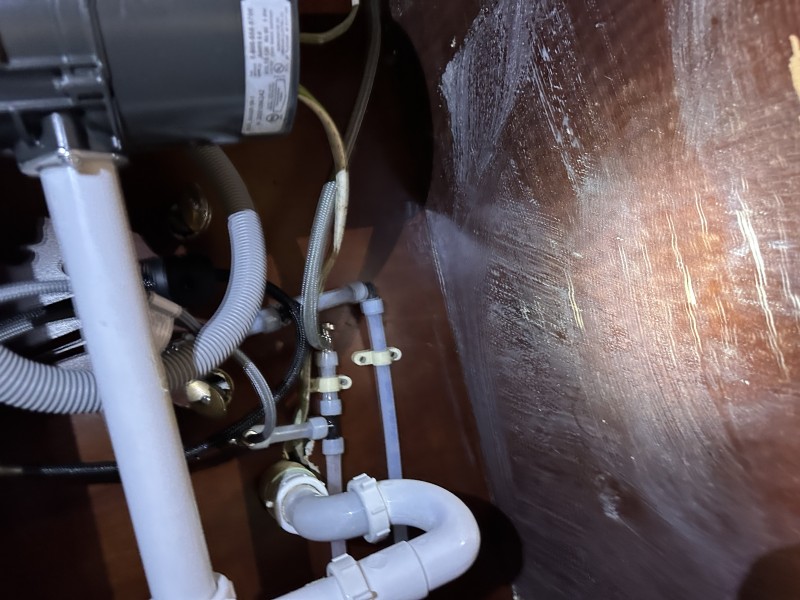 Under-sink plumbing reroute using PEX and PVC