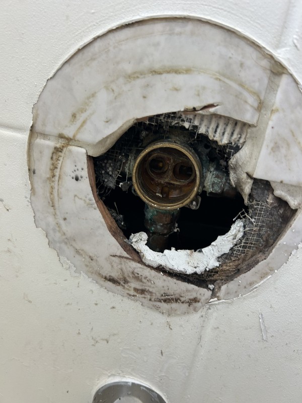 Delta shower valve behind tile wall