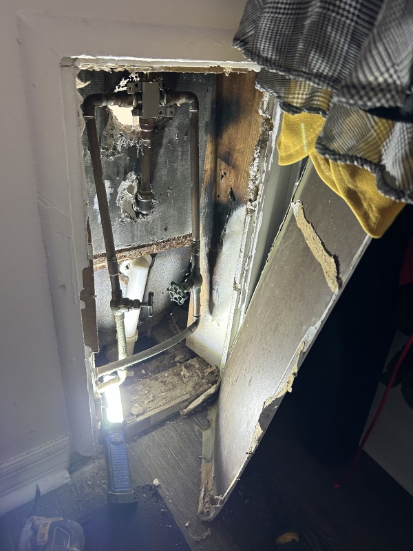 Shower plumbing behind wall