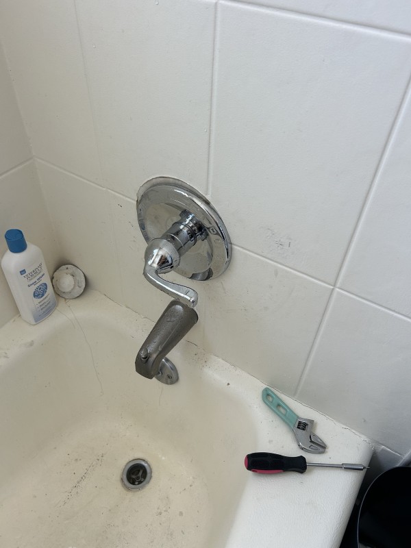 Close-up of finished shower handle repair