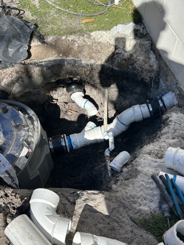 Outdoor sewage pump ejector system piping with PVC fittings