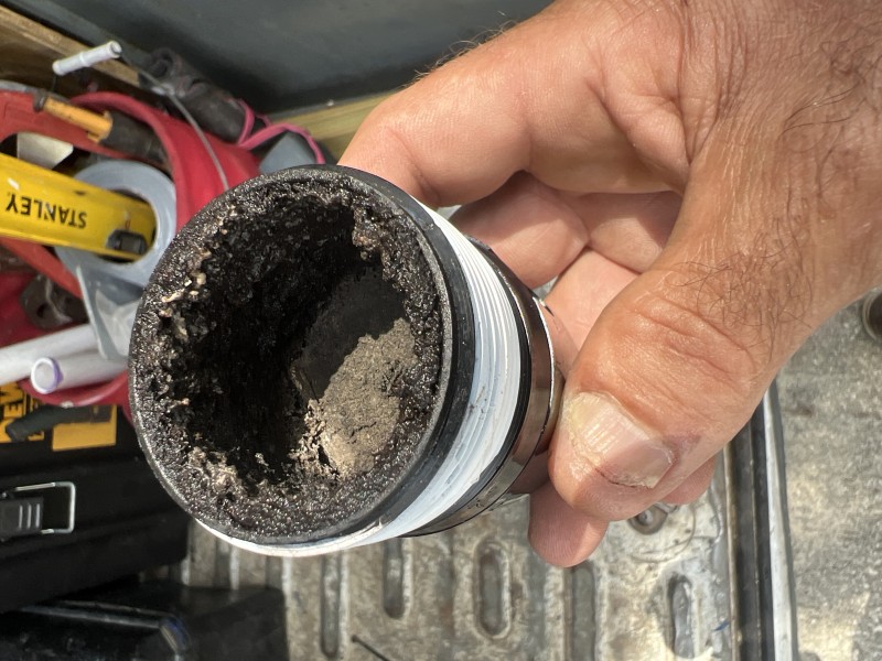 Plumber diagnosing bathroom drain blockage in Tampa home