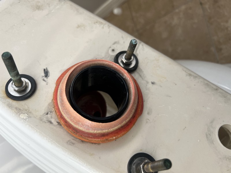 Toilet tank repair in progress