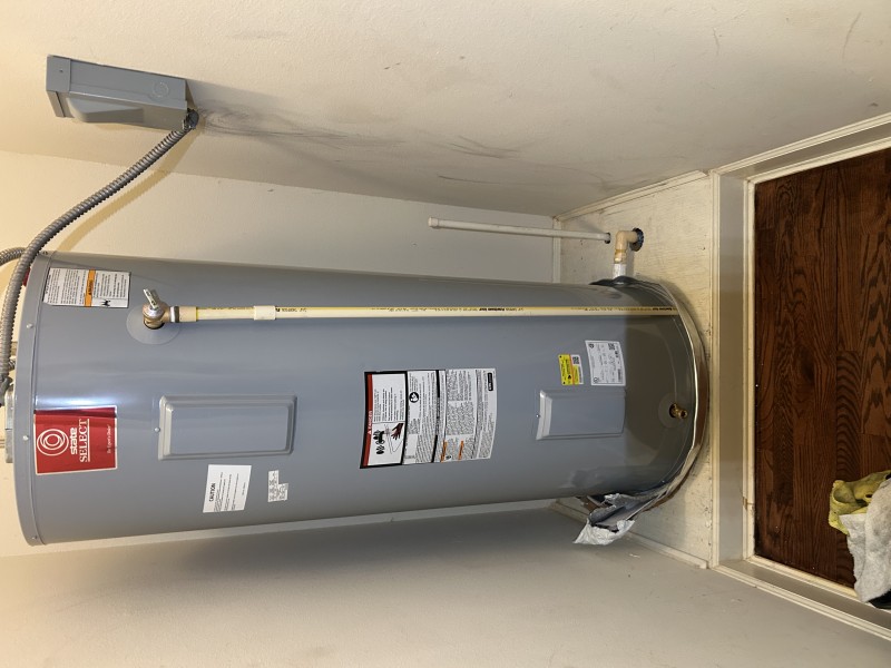 New 80-gallon tank being connected with braided stainless lines