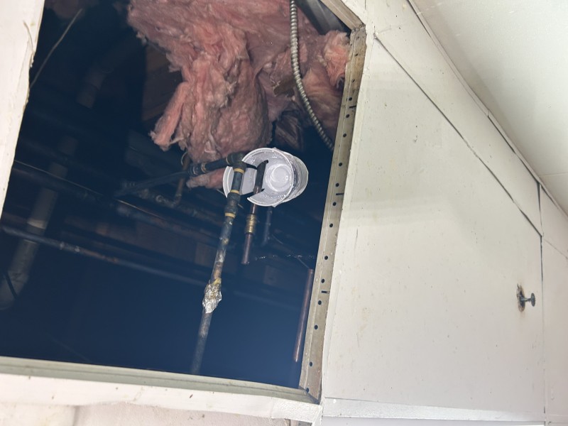 Completed hose bib repair with pressure test confirming a watertight seal