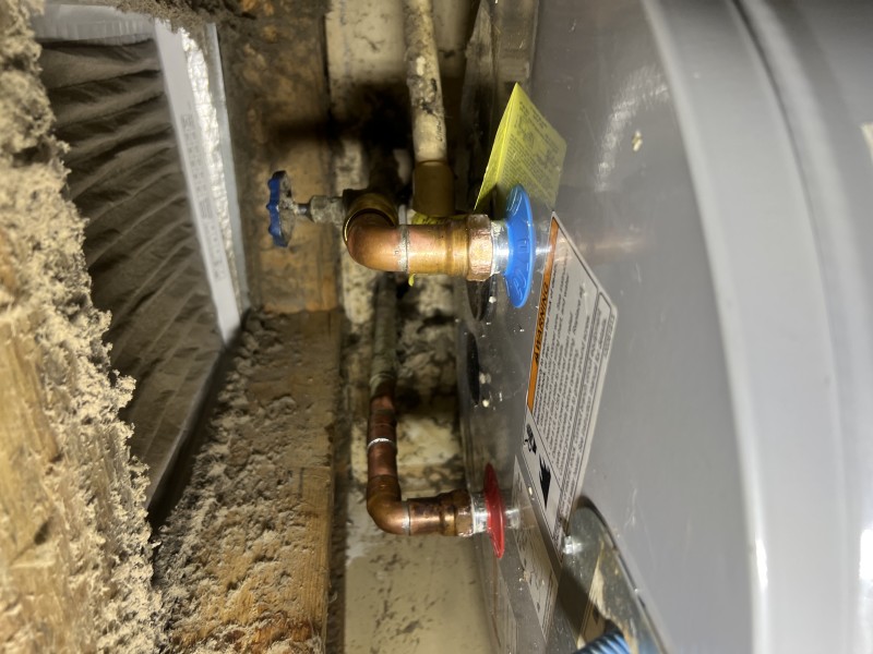 Water heater thermostat adjustment