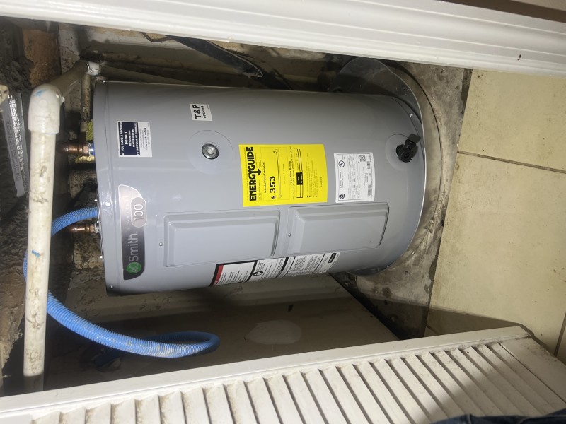Water heater installed in drain pan
