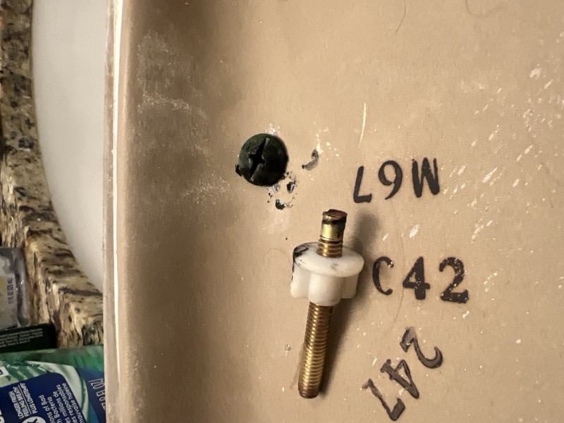 Installing a new tank-to-bowl gasket with stainless/brass bolts and nylon washers