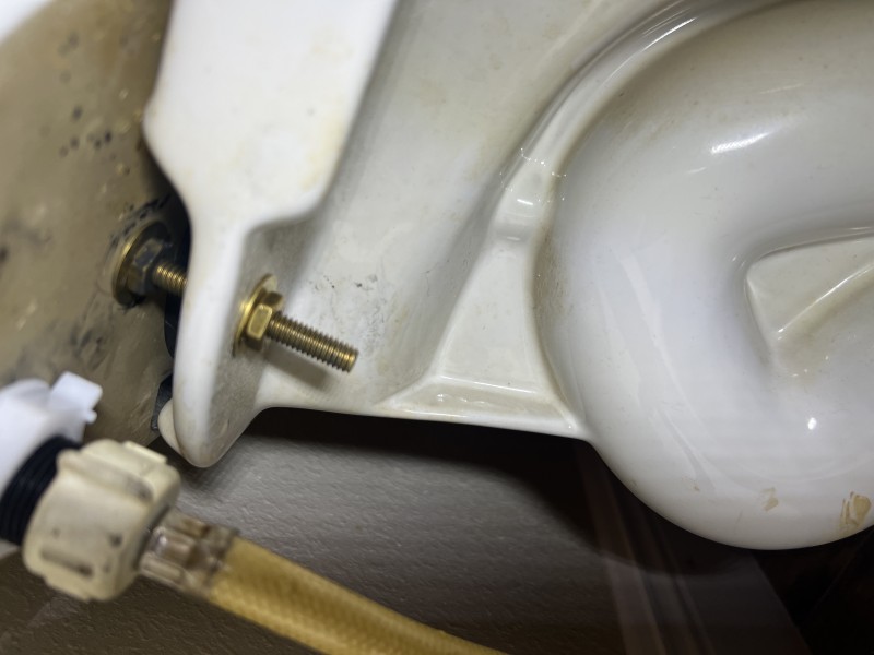 Multiple test flushes and visual leak checks at bolts, gasket interface, and supply line
