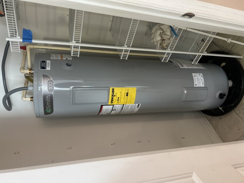 Setting and leveling the new water heater with new copper connections