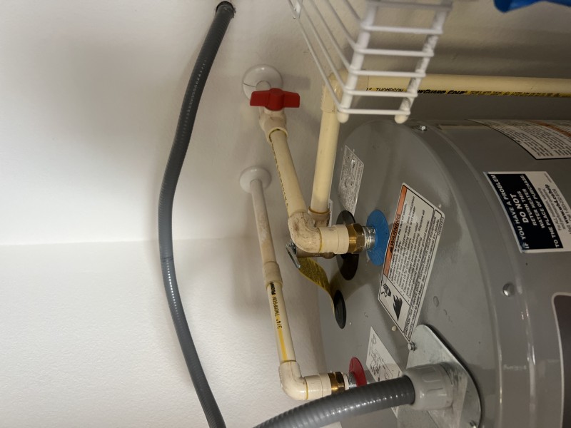 Completed electric water heater installation after code and safety checks