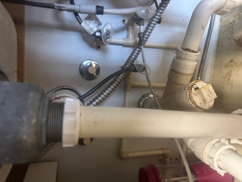 Completed master trap replacement under sink with clean work area