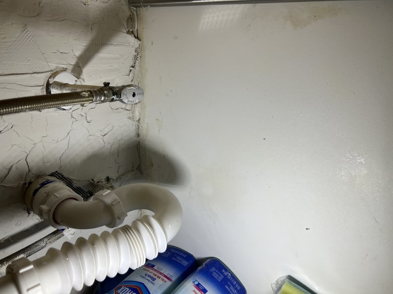 Replacing worn compression fitting and reseating washers under the sink