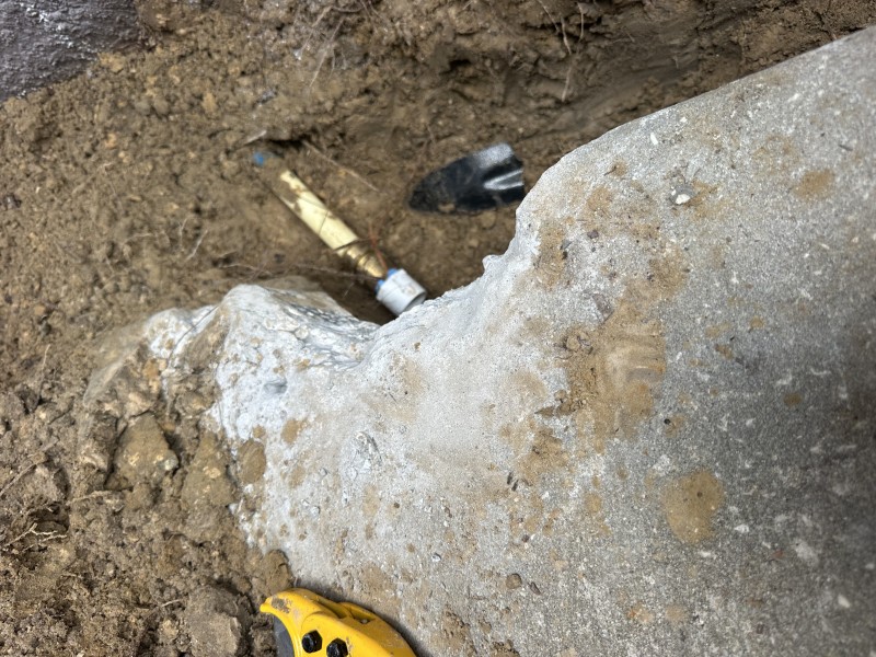Repair in progress: preparing the PEX to PVC transition under the slab.
