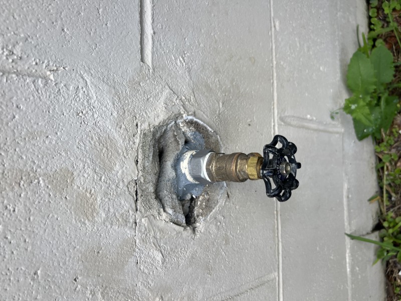 Careful stucco opening to expose CPVC supply line and connection for hose bib replacement