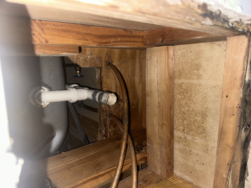 Dry fitting PVC P-trap and fittings to align with tub waste outlet