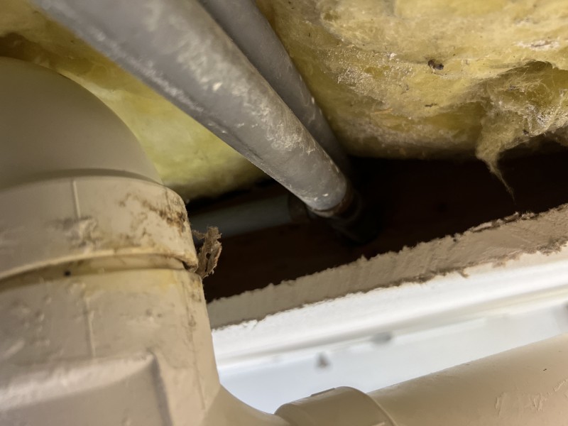 Close-up of unglued washer box hub and loose standpipe connection