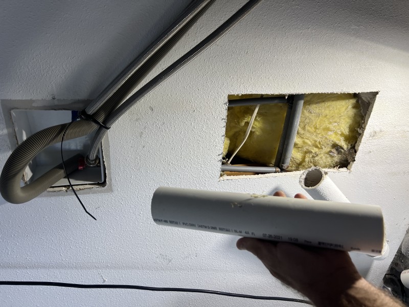 Applying primer and PVC cement to schedule 40 fittings and standpipe