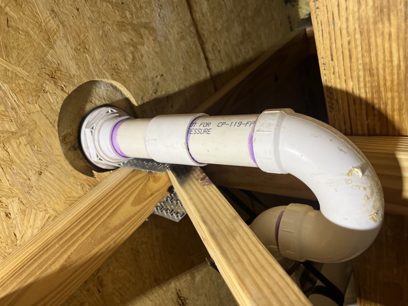 Installing new Schedule 40 PVC drain and sealing with plumber’s putty and silicone