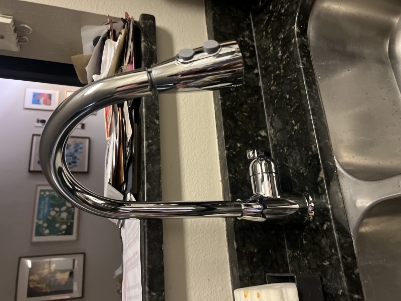 Under-sink plumbing with compression fittings, shutoff valves, and stainless braided supply lines after faucet replacement