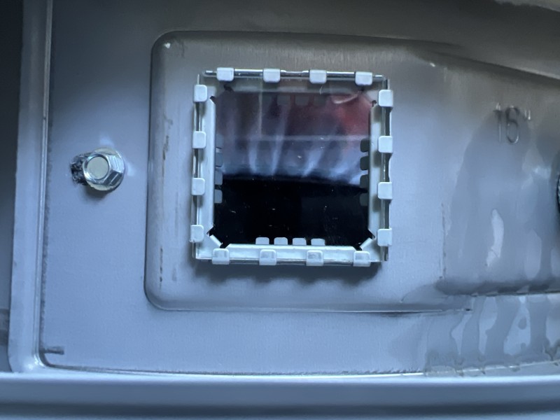 View of the water heater and nearby plumbing lines from a different angle