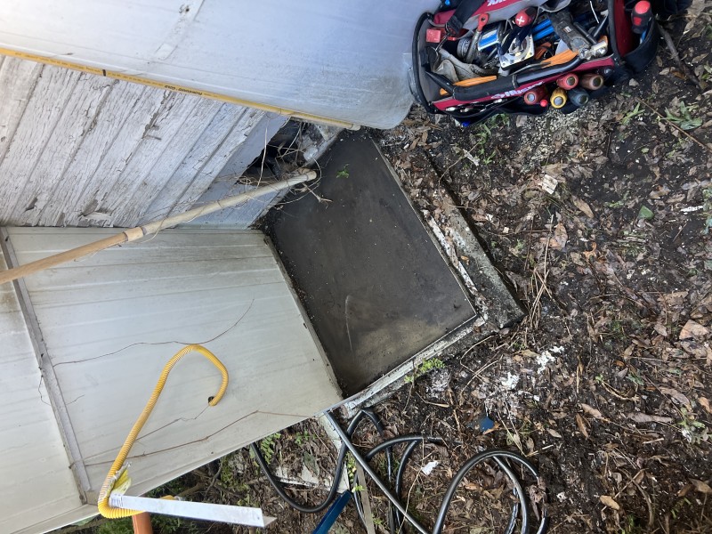 Side view of the water heater showing adjacent piping and nearby surfaces