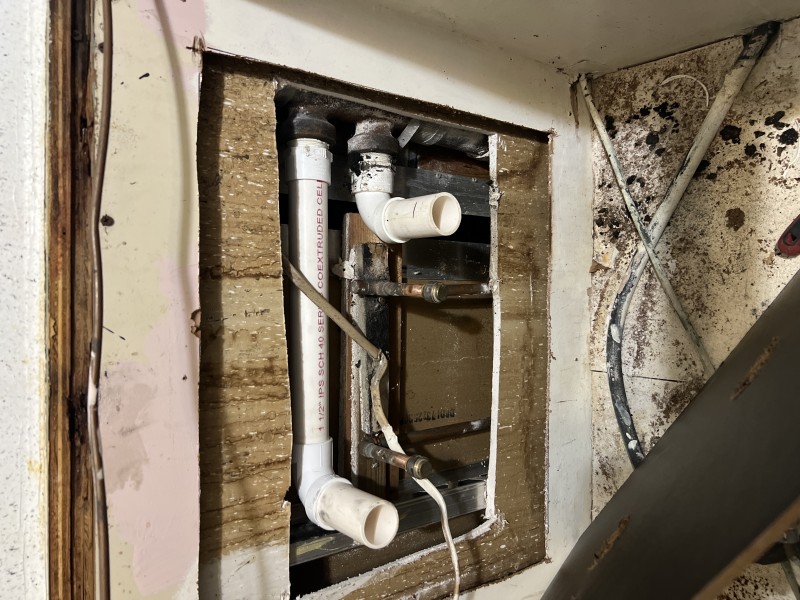 Replacing failed cast iron bands and repairing the kitchen drain arm