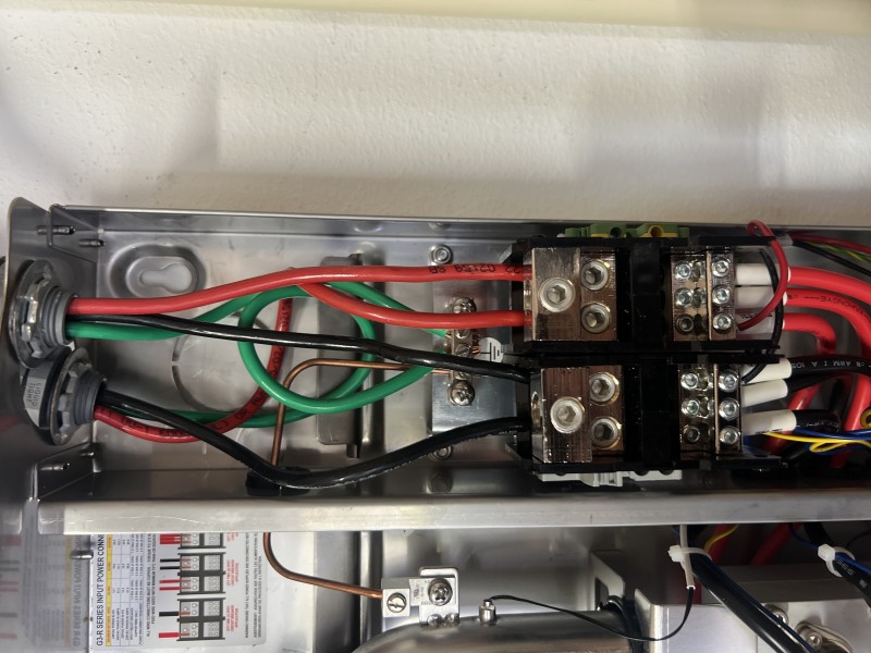 Installing gas flex line and performing leak test on tankless heater