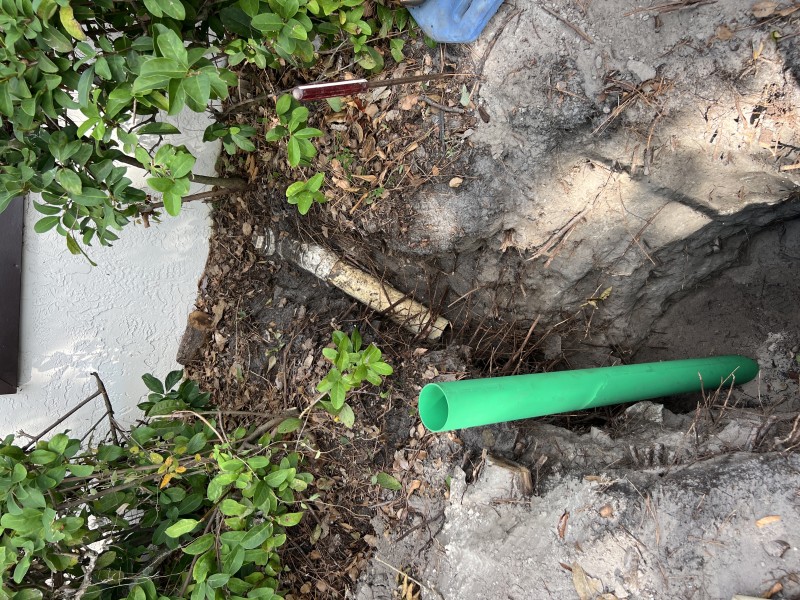 Close view of PVC fittings being connected during sewer line repair