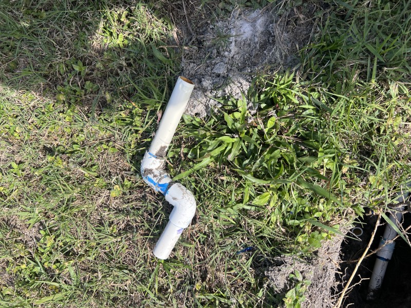 Preparing pipe ends and staging water-service-rated fittings for the underground repair, Deltona, FL, mid-December 2025