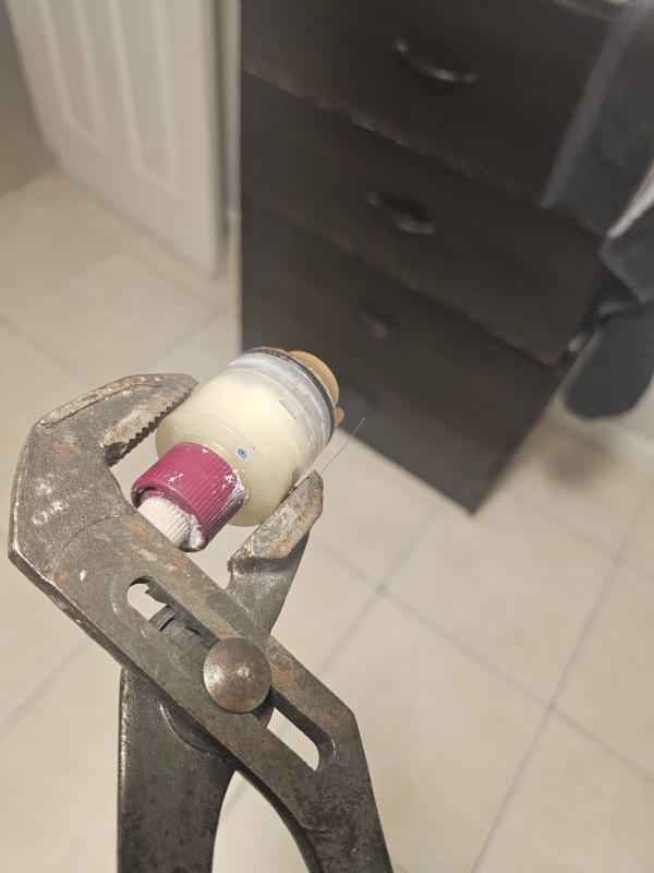Removed shower cartridge showing signs of wear and internal sticking, Spring Hill, FL, December 2025