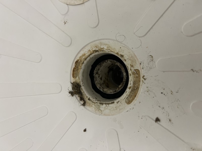 Shower pan drain opening with PVC pipe alignment checked before resealing, Zephyrhills, FL, December 2025