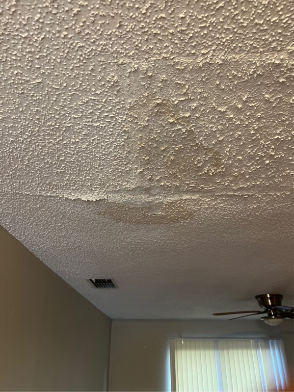 Ceiling water stain caused by an attic water heater leak prior to replacement in Lakeland, FL, December 2025