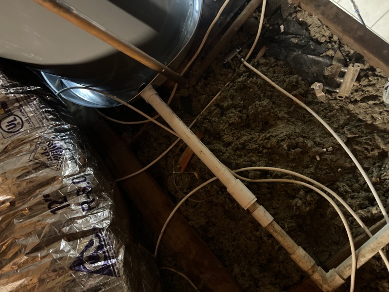 Final drain pan and piping inspection after attic water heater replacement in Lakeland, FL, December 2025