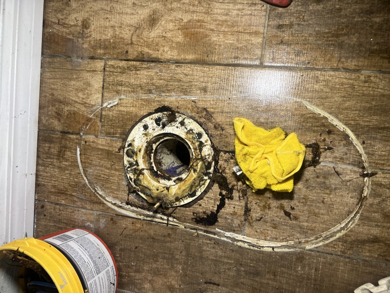 Toilet pulled to expose the flange and allow direct access for snaking the branch drain line, Plant City, FL, December 24, 2025