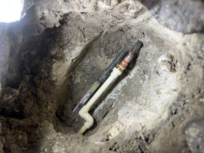 Exposed under-slab 1/2-inch copper water line after access was opened, showing the repair area and post-repair verification, Valrico, FL, December 31, 2025