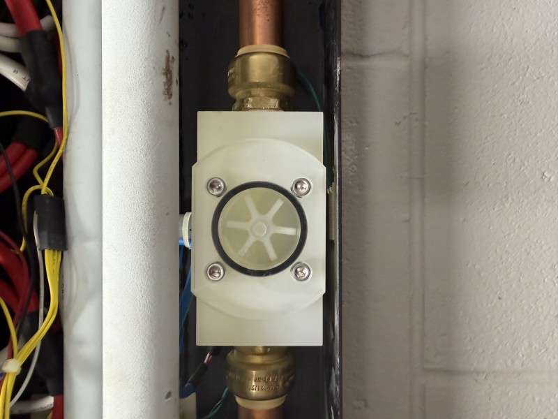 Final system test after tankless water heater flush and repair confirming restored hot water, Tampa, FL, January 14, 2026