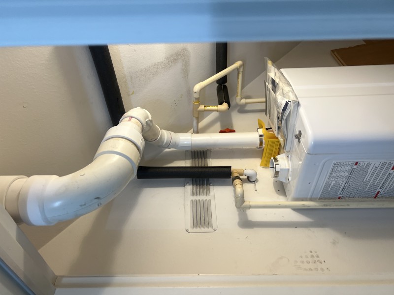 Navien NPE-240 tankless installed with PVC venting and piping layout visible during setup, Tampa, FL, February 2026