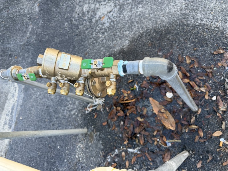 New Wilkins 975 XL RPZ backflow preventer positioned in-line with shutoff handles visible after replacement, Lake Wales FL, February 23 2026