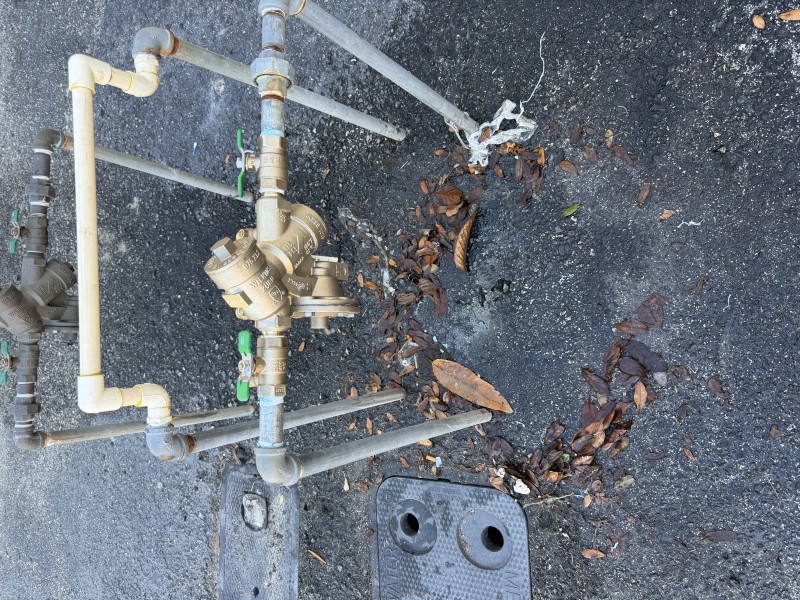 Wide shot of the completed backflow preventer replacement with connected piping and surrounding setup visible, Lake Wales FL, February 23 2026