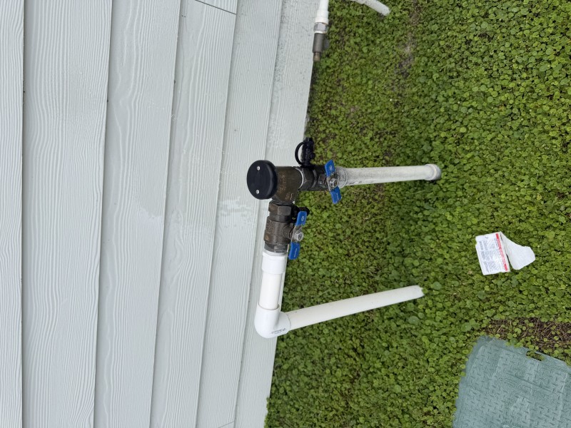 Hands-on service work on the 1-inch RPZ assembly and fittings to stop the irrigation backflow leak, Ocala FL, March 3 2026