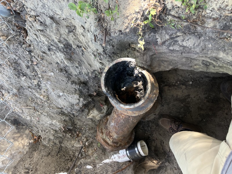 Exposed cast iron hub and open sewer pipe ready for new connection, Zephyrhills FL, March 2026