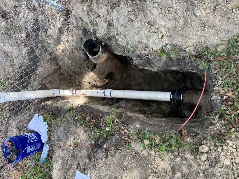 New PVC sewer pipe installed and connected to cast iron using transition coupling, Zephyrhills FL, March 2026