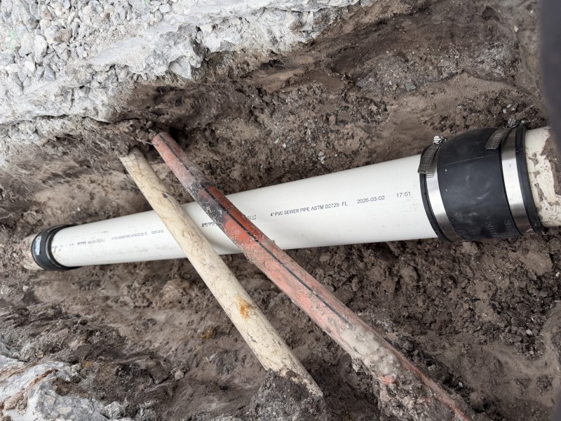 Backfilled sewer repair excavation before concrete restoration in New Port Richey, Florida, May 2026