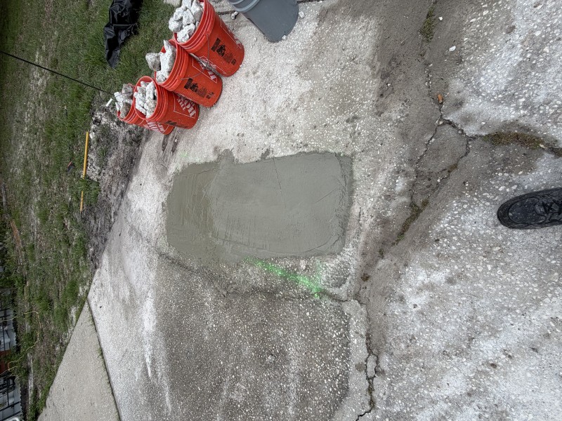 Completed driveway concrete restoration after sewer line repair in New Port Richey, Florida, May 2026